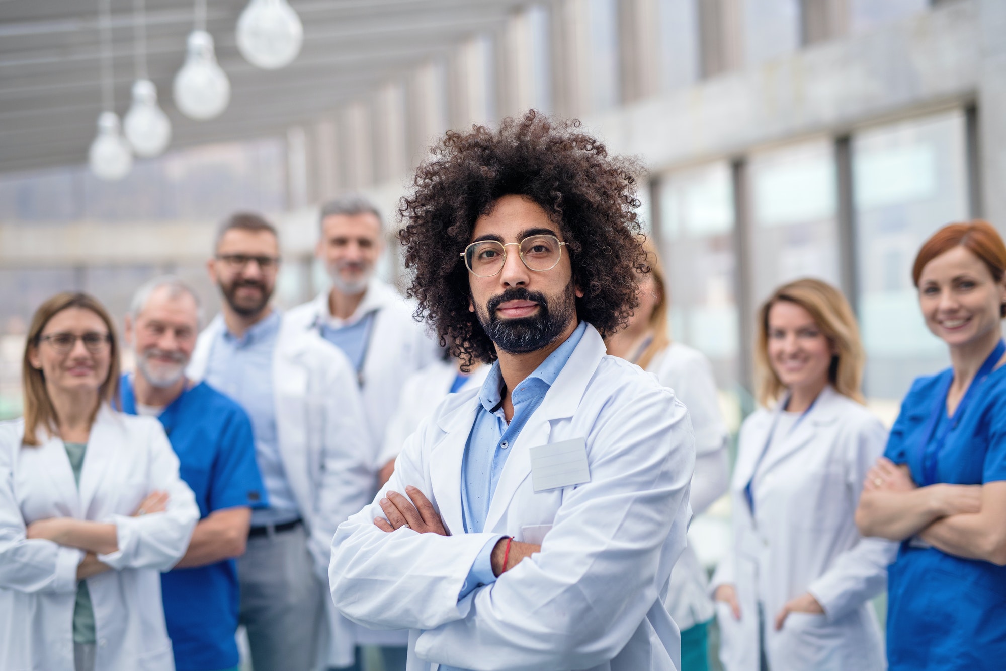 group-of-doctors-standing-in-corridor-on-medical-conference.jpg